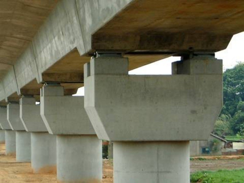 Pot bearing assemblies beneath bridge support