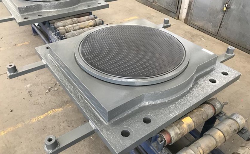 Spherical bearing component detail on a workshop bench